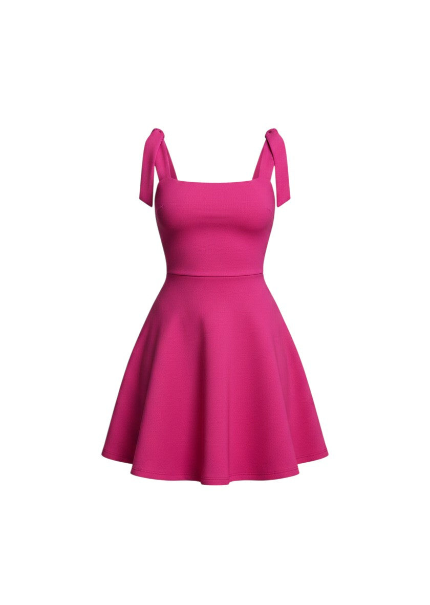 cottonandlily pink mini dress with a square neckline, sleeveless design, and wide adjustable shoulder tie straps.